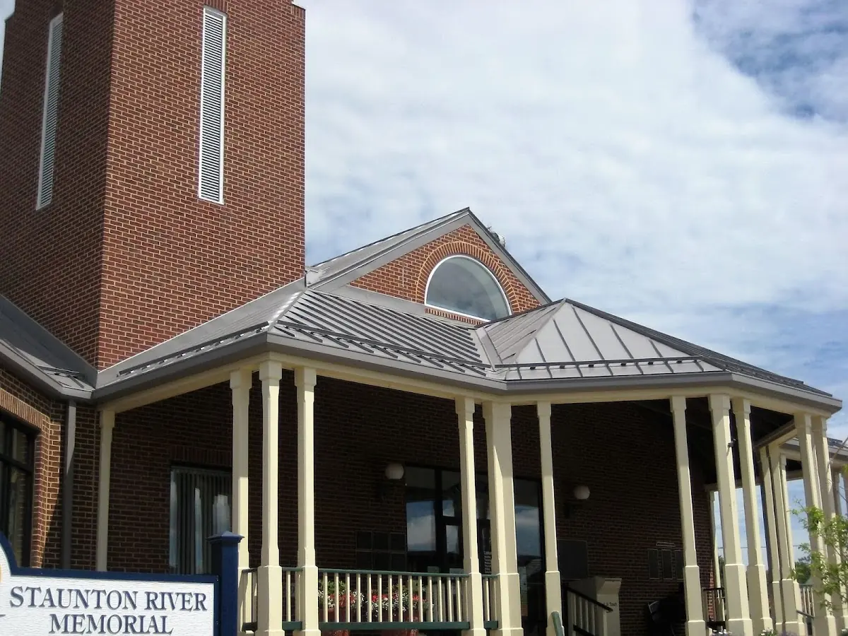 Skilled roofing craftsmen working on a residential roof in Golda Meir Kent Jewish Center
